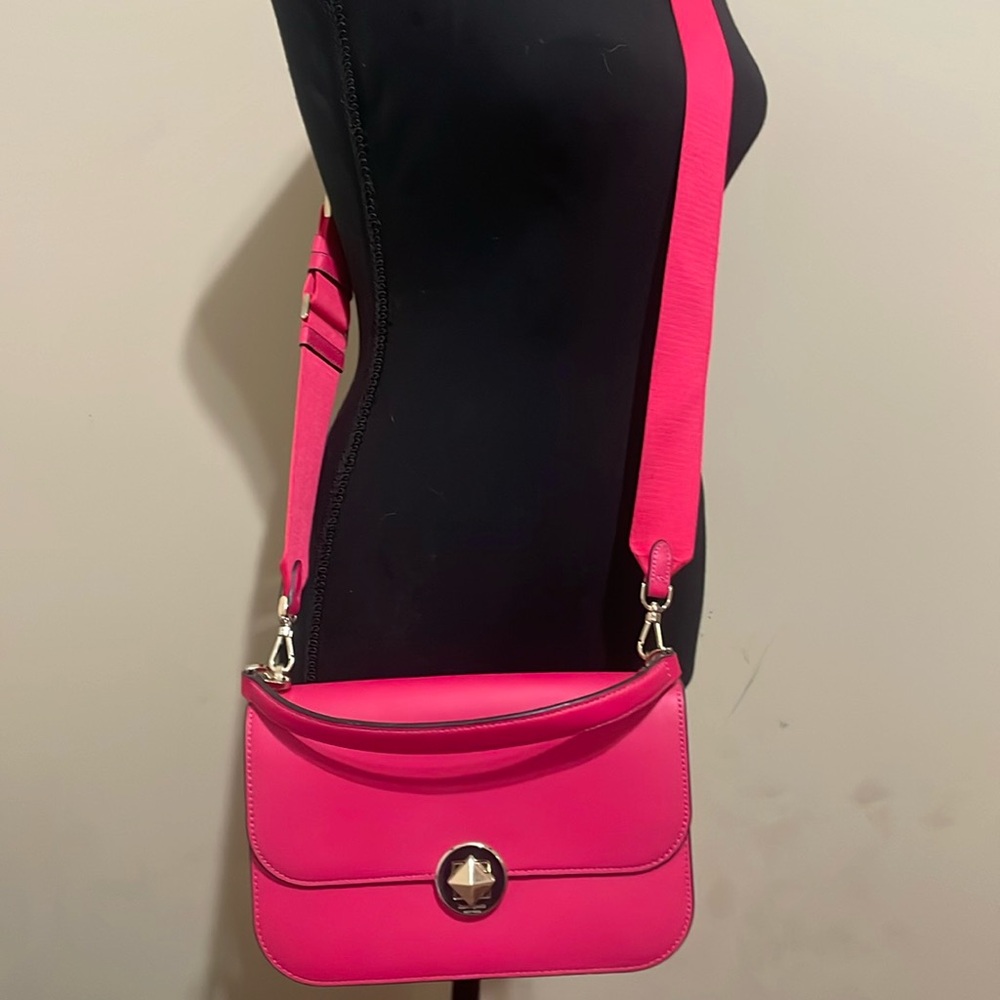 Kate Spade crossbody with two straps. Dark pink in color with gold accents